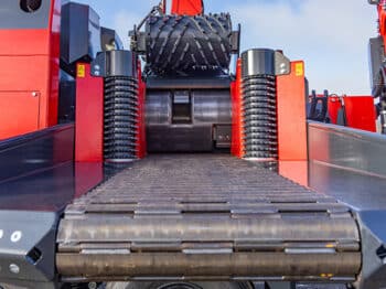Continuous infeed chain to below the top roller(s)